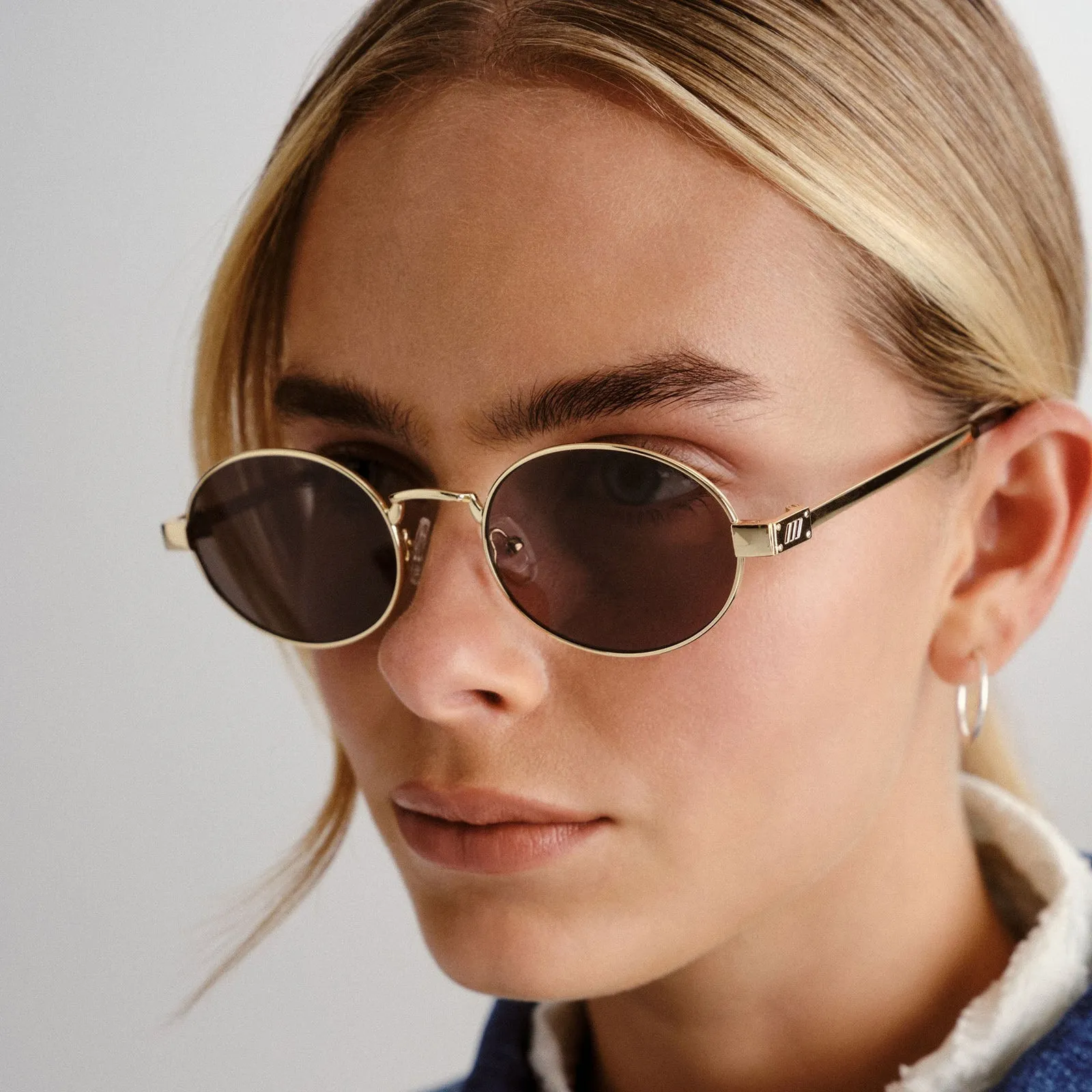 Le Specs Poseidon Deux Sunglasses in Gold and Khaki Mono Lenses